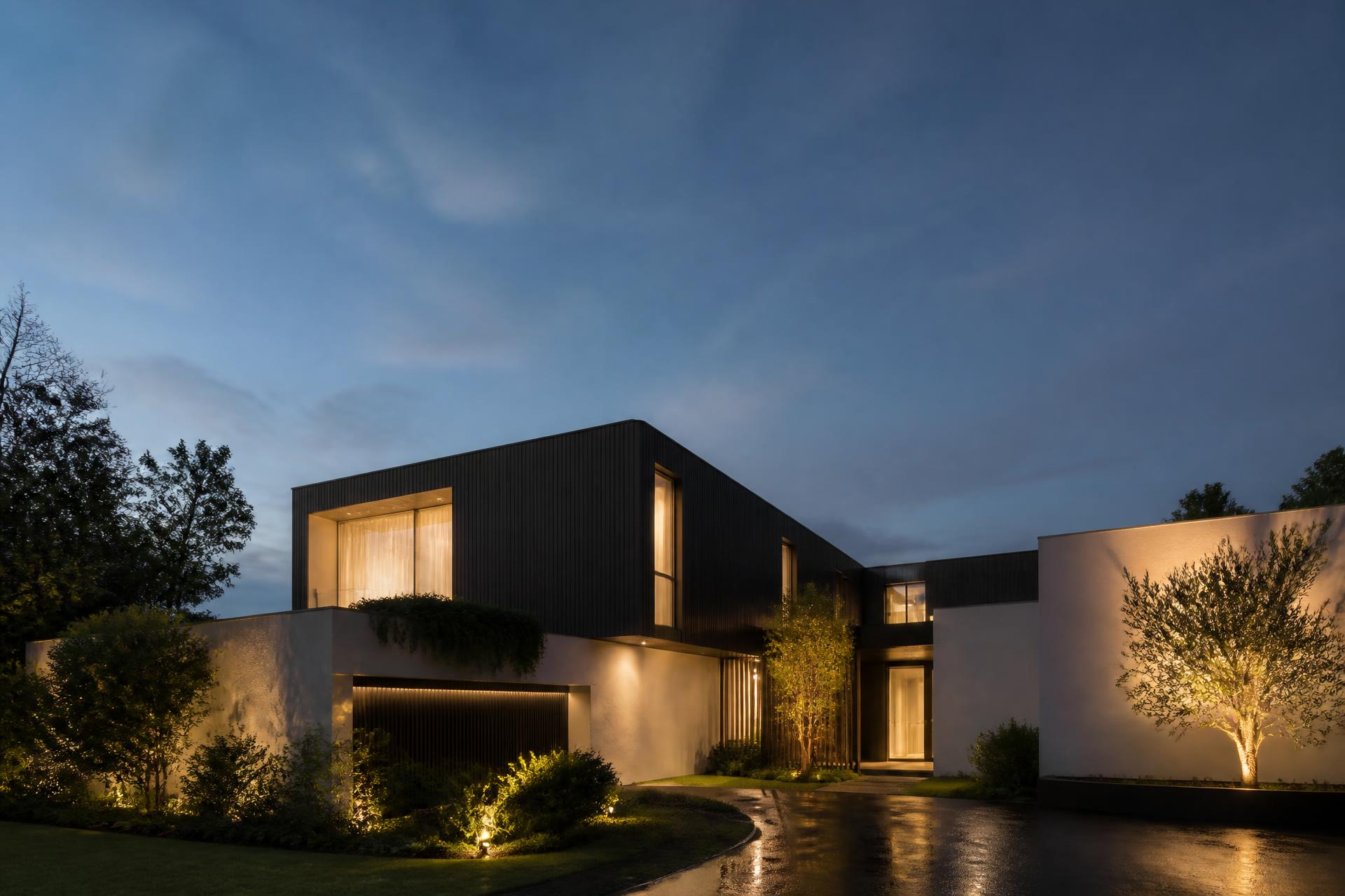 Modern Sydney luxury home lit at dusk